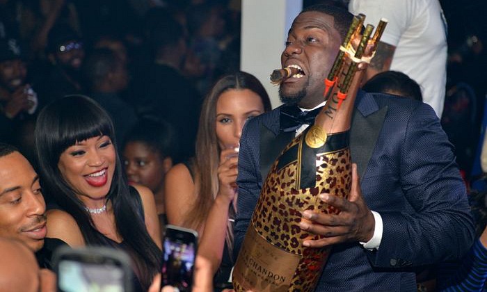 Kevin Hart with Moet NIR Leopard bottle THUMB
