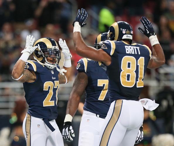 St. Louis Rams put their “hands up”