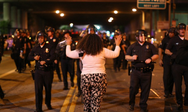 Protestor Holding Her Hands Up