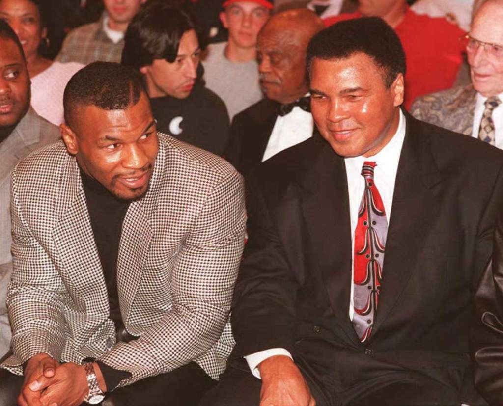 Former heavyweight boxing champion Mike Tyson (L)