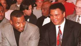 Former heavyweight boxing champion Mike Tyson (L)